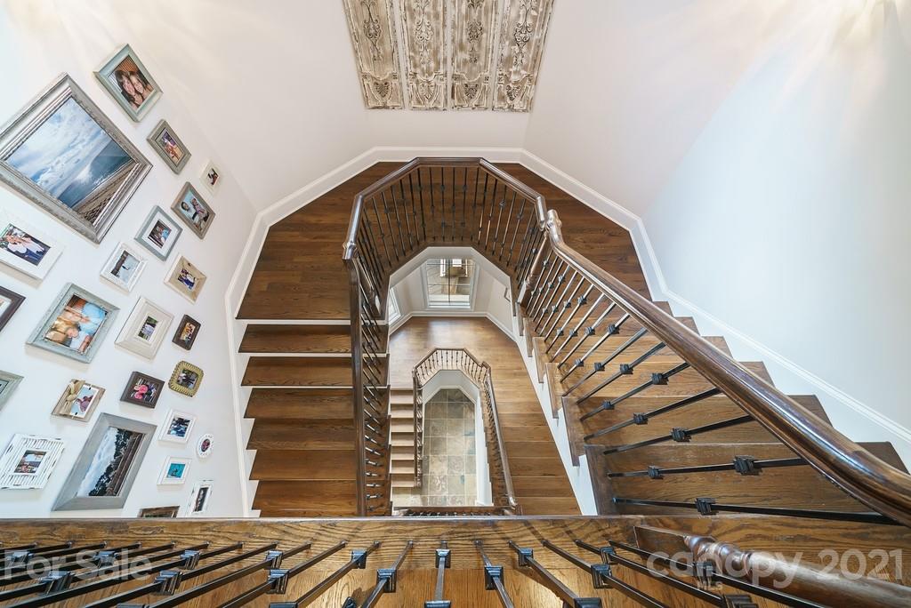 7033 Willow Trace Lane Matthews, NC 28104 - Photo 22 of 48 a view of a balcony with a fireplace