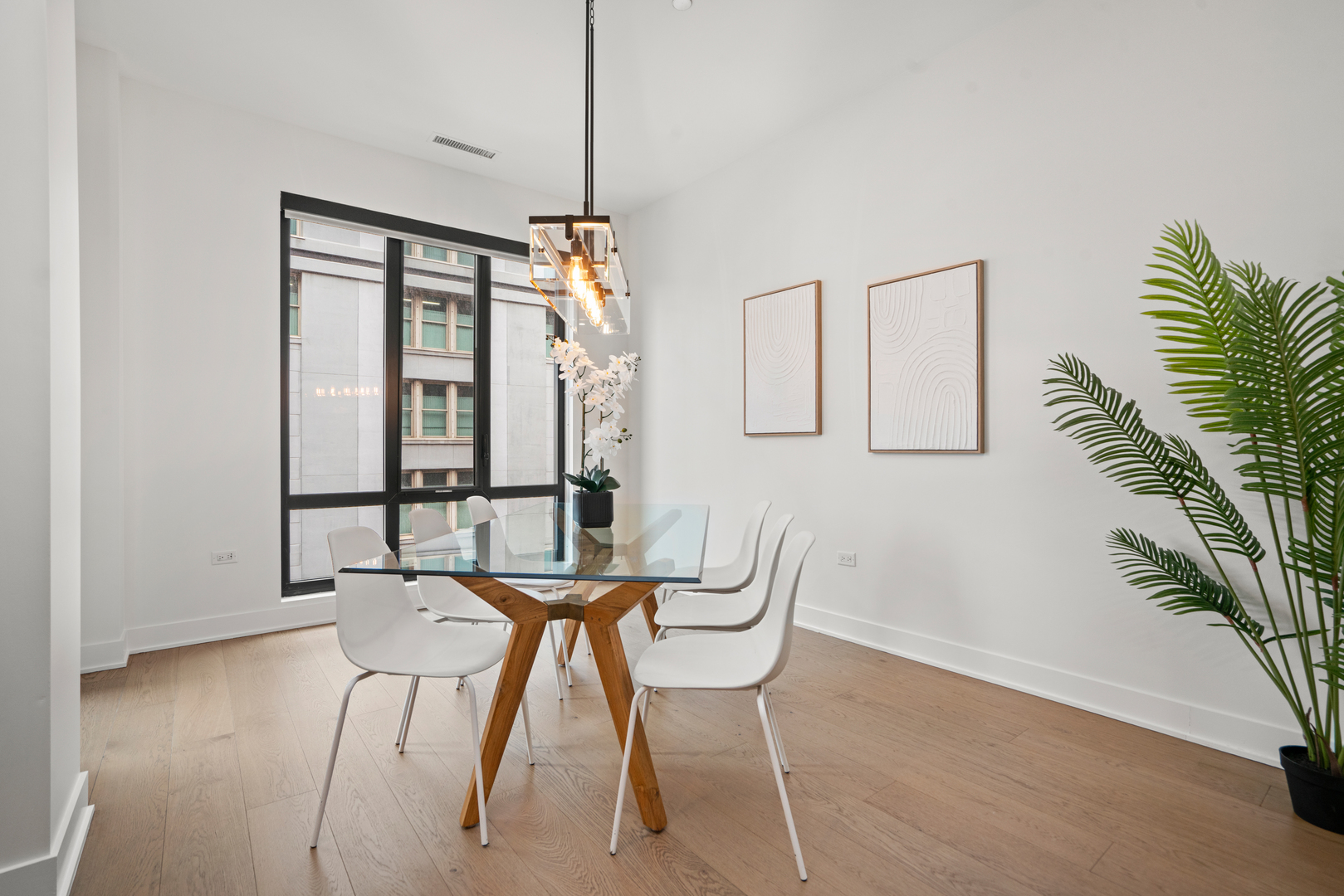 313 South Racine Avenue, Unit 4B Chicago, IL 60607 - Photo 13 of 33 a view of a room with furniture and wooden floor