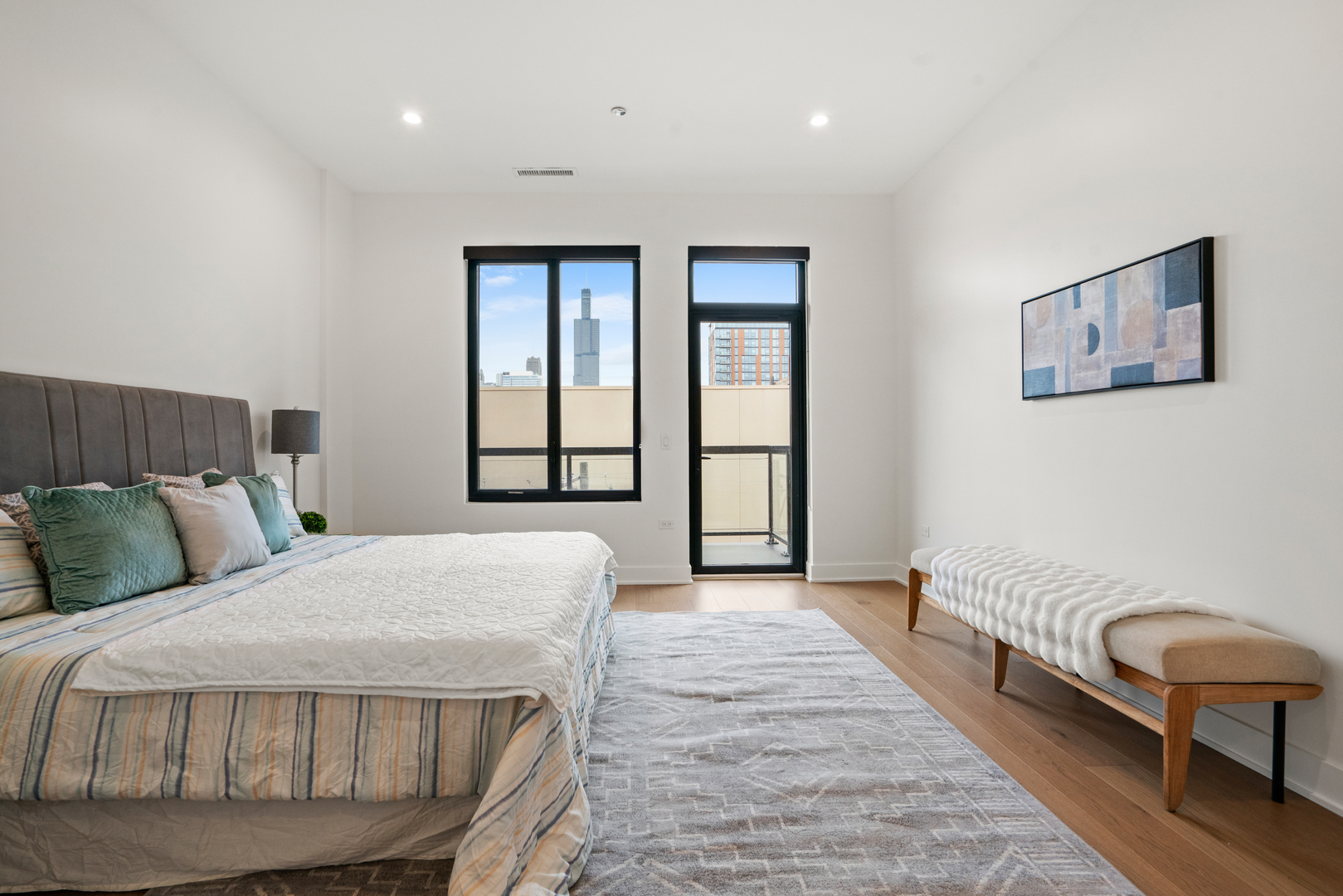 313 South Racine Avenue, Unit 4B Chicago, IL 60607 - Photo 16 of 33 a bedroom with a bed a couch and a window