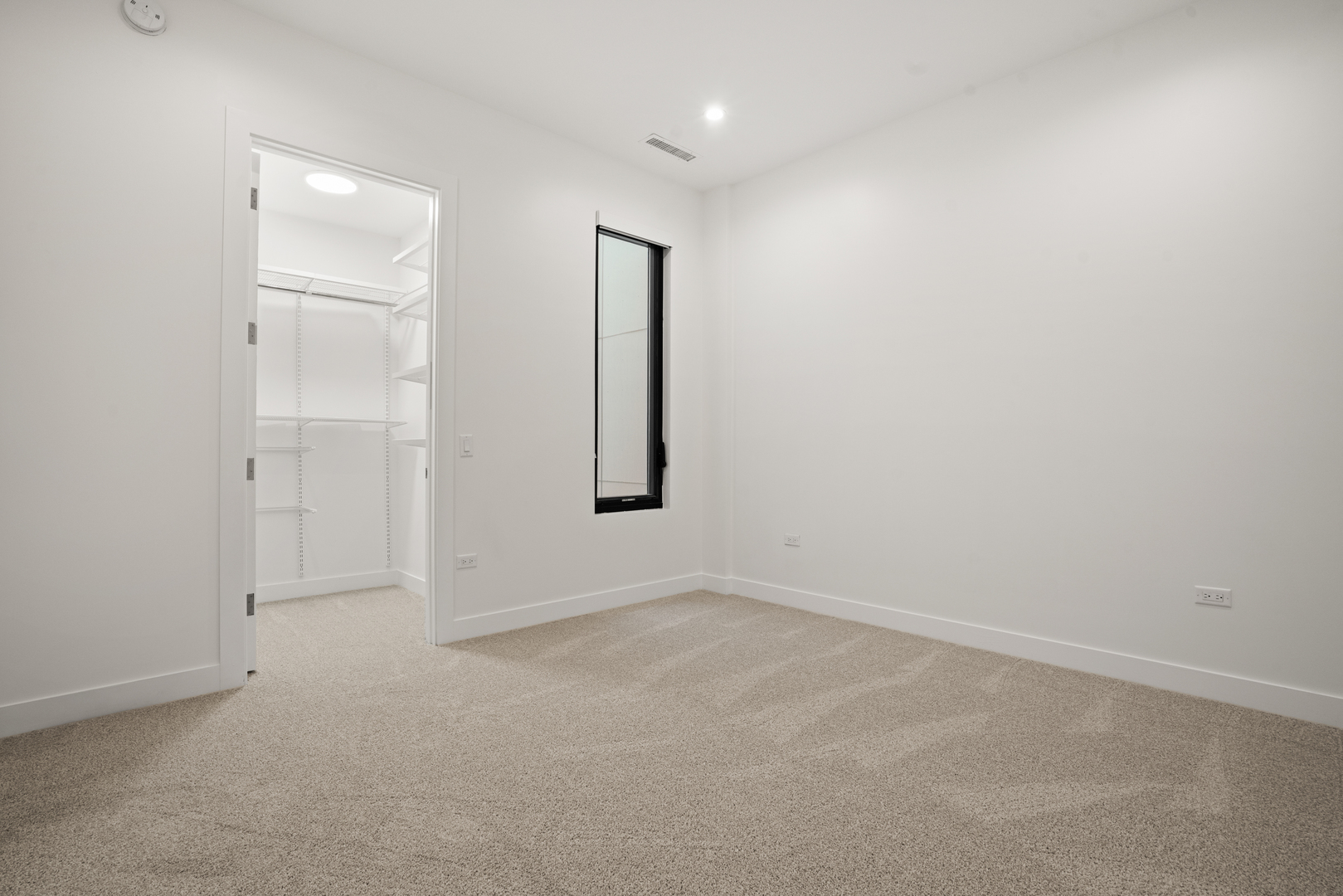 313 South Racine Avenue, Unit 4B Chicago, IL 60607 - Photo 24 of 33 an empty room with windows and closet