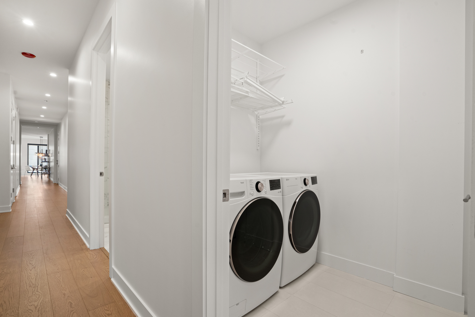313 South Racine Avenue, Unit 4B Chicago, IL 60607 - Photo 31 of 33 a view of a hallway with washer and dryer