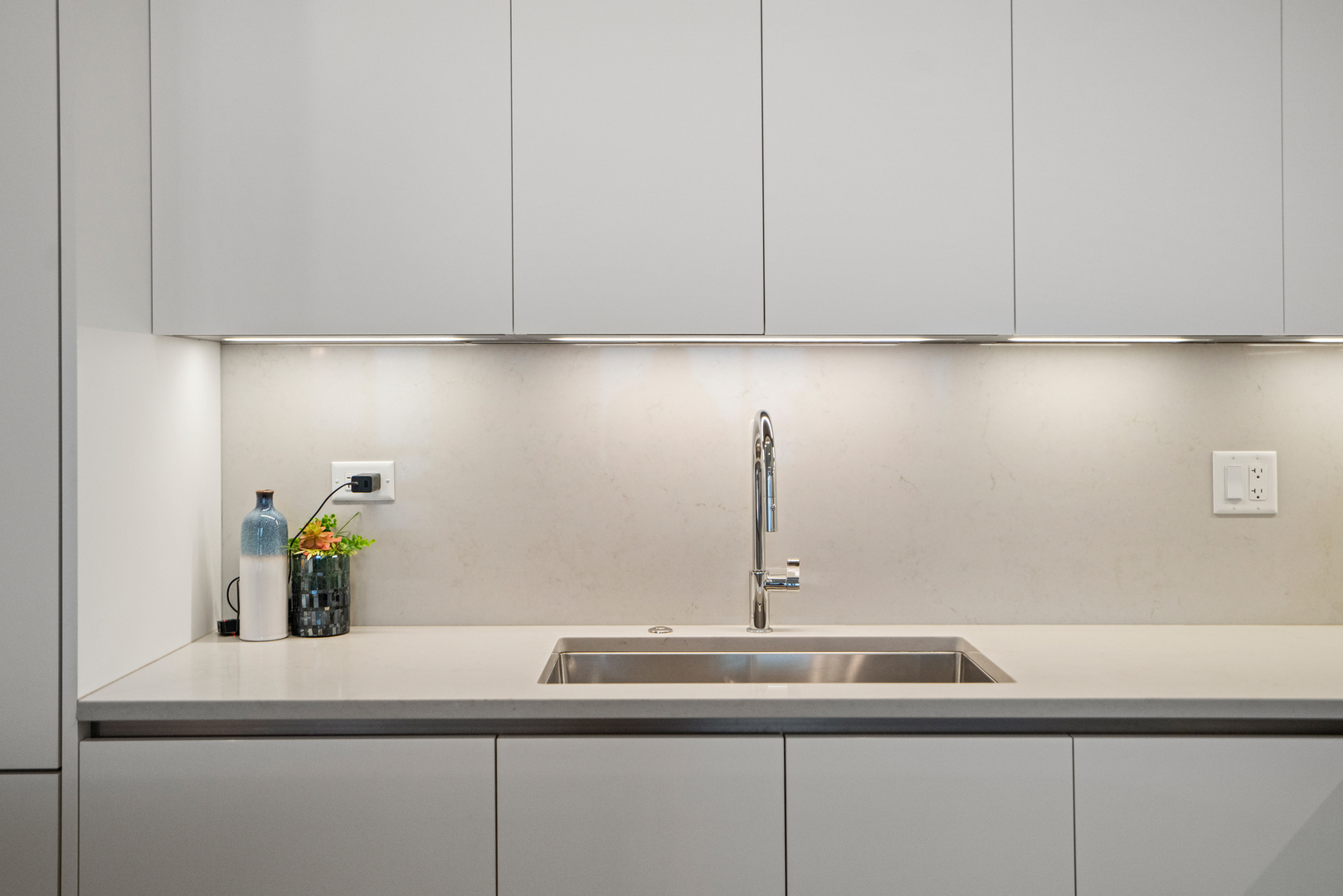 313 South Racine Avenue, Unit 4B Chicago, IL 60607 - Photo 5 of 33 a kitchen with a sink and cabinets