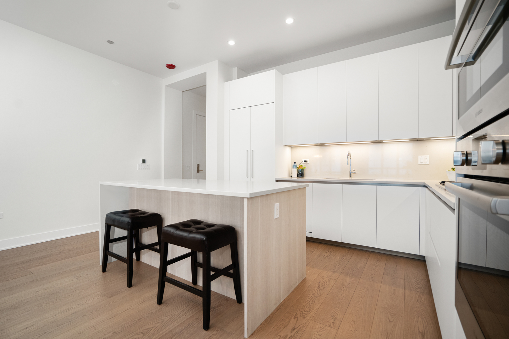 313 South Racine Avenue, Unit 4B Chicago, IL 60607 - Photo 6 of 33 a kitchen with white cabinets and sink
