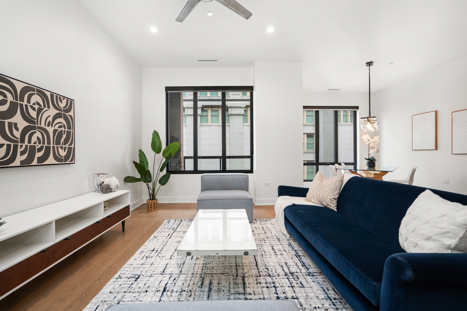 313 South Racine Avenue, Unit 4B Chicago, IL 60607 - Photo 9 of 33 a living room with furniture and a potted plant