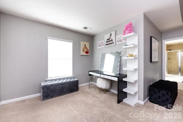 a bedroom with furniture and a window