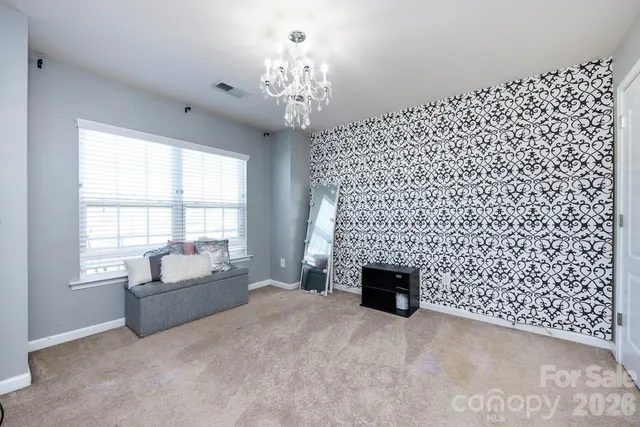 a living room with a fireplace and a window