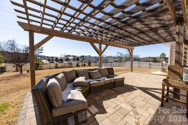 a outdoor living space with patio furniture and a fire pit