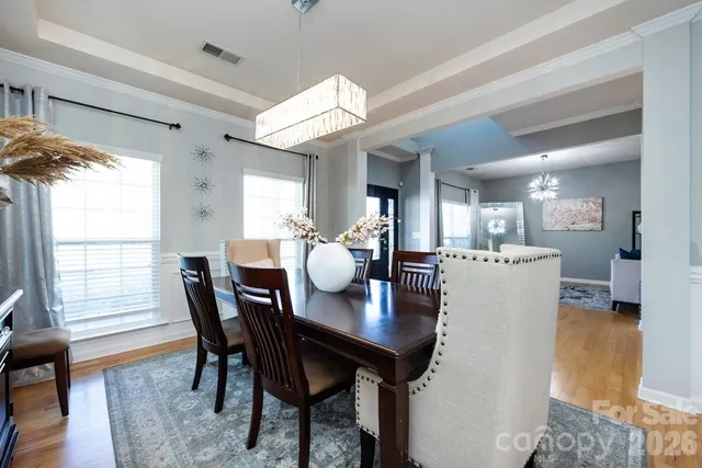 a dining room with furniture and window