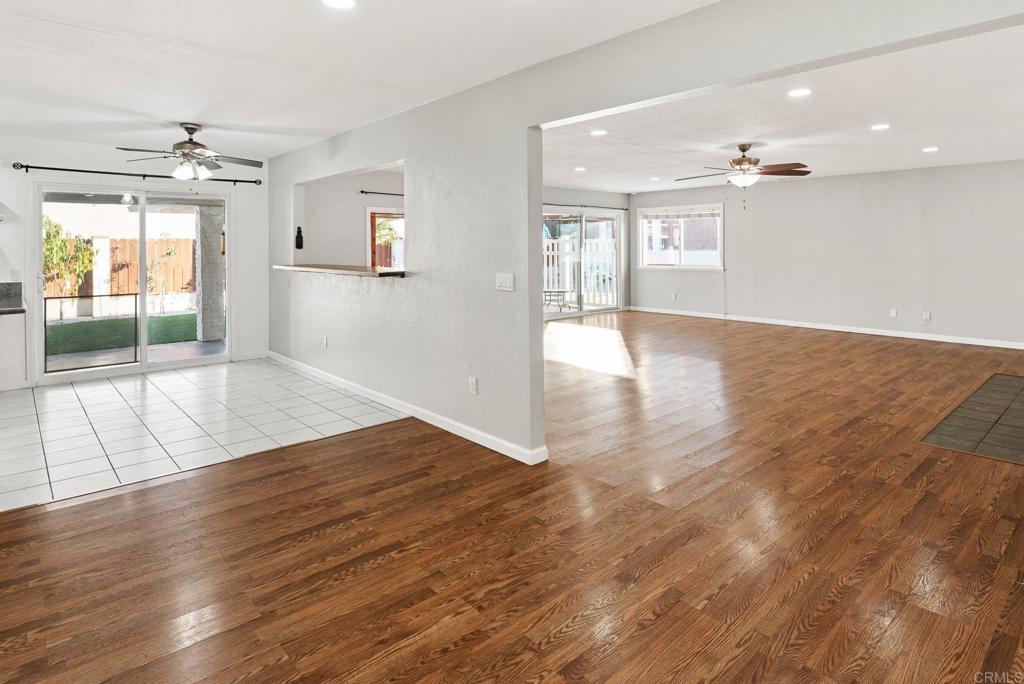 13131 Chrissy Way Lakeside, CA 92040 - Photo 11 of 30 an empty room with wooden floor and windows