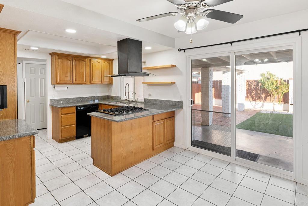 13131 Chrissy Way Lakeside, CA 92040 - Photo 12 of 30 a kitchen with stainless steel appliances granite countertop a stove a sink and a refrigerator