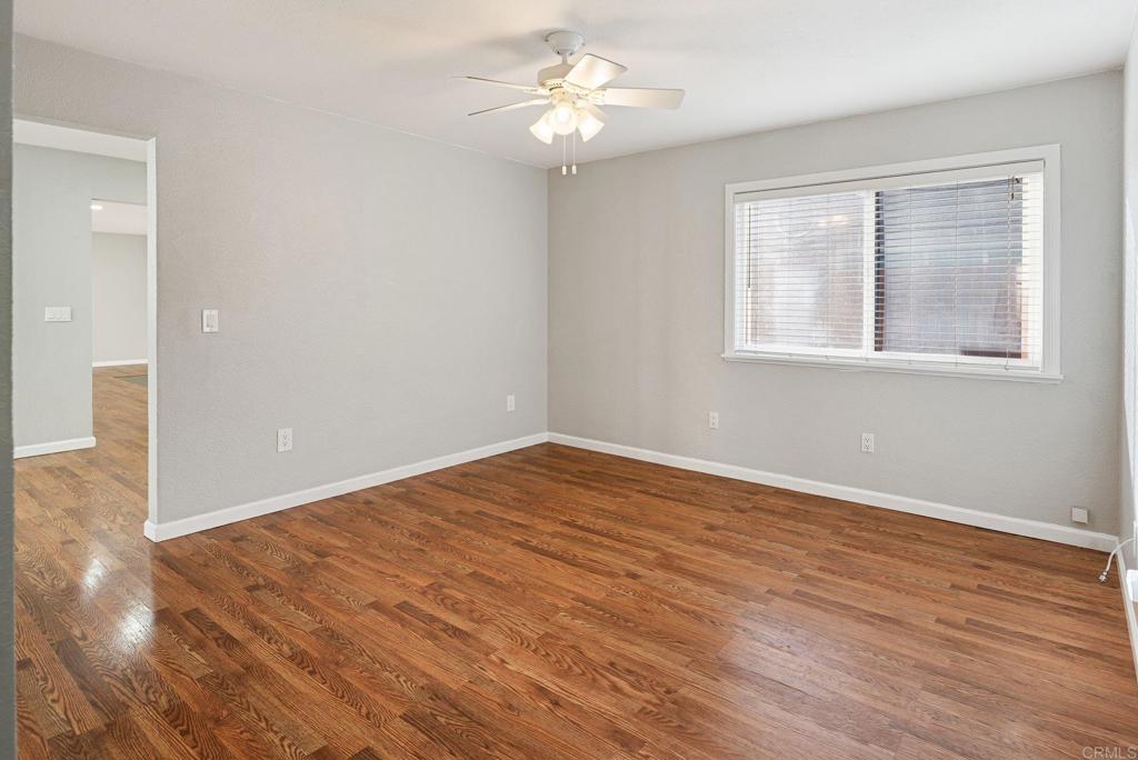 13131 Chrissy Way Lakeside, CA 92040 - Photo 20 of 30 a view of empty room with wooden floor and fan