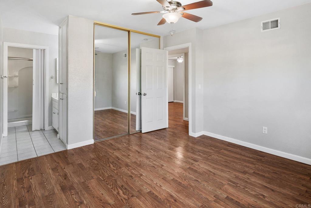 13131 Chrissy Way Lakeside, CA 92040 - Photo 22 of 30 an empty room with wooden floor and mirror