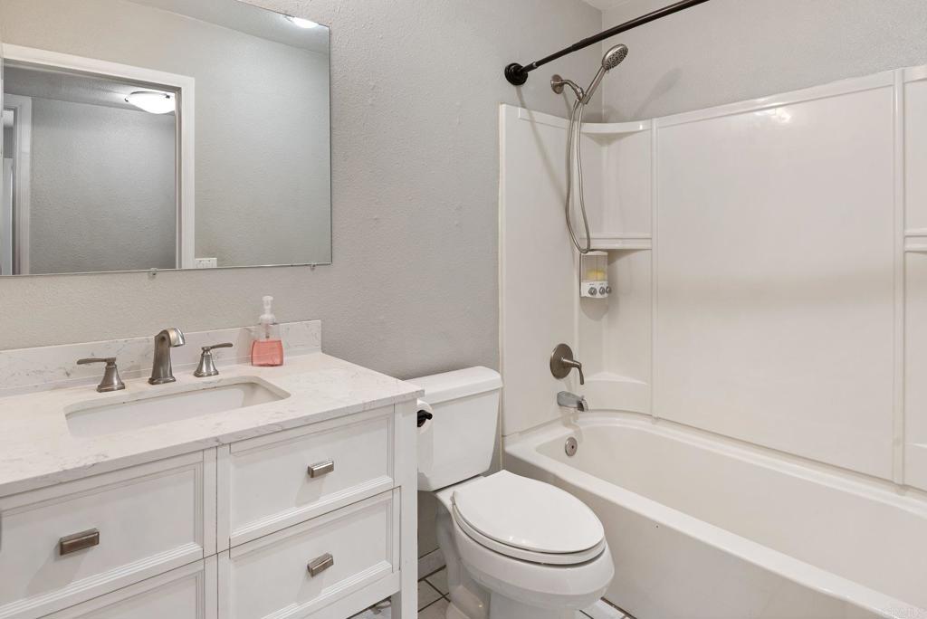 13131 Chrissy Way Lakeside, CA 92040 - Photo 25 of 30 a bathroom with a granite countertop sink toilet and shower