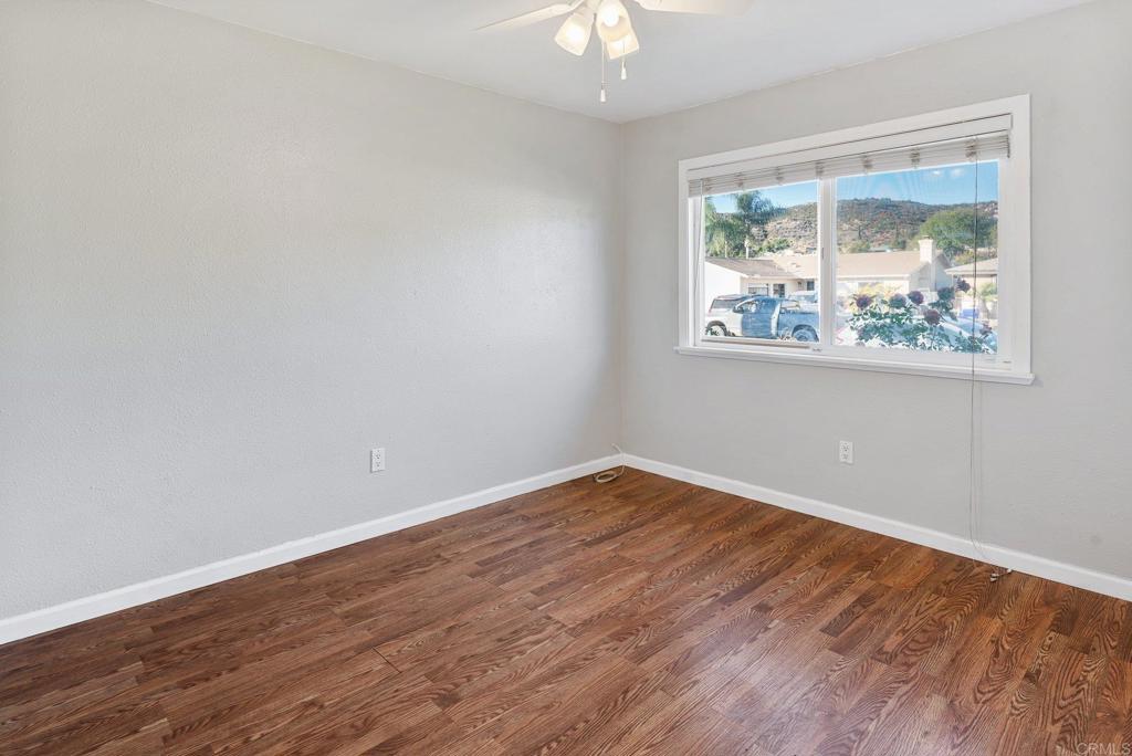 13131 Chrissy Way Lakeside, CA 92040 - Photo 26 of 30 a view of an empty room with wooden floor and a window