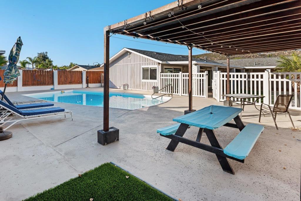 13131 Chrissy Way Lakeside, CA 92040 - Photo 28 of 30 a backyard of a house with barbeque oven and outdoor seating