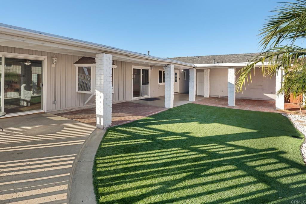 13131 Chrissy Way Lakeside, CA 92040 - Photo 4 of 30 a front view of a house with a yard and potted plants