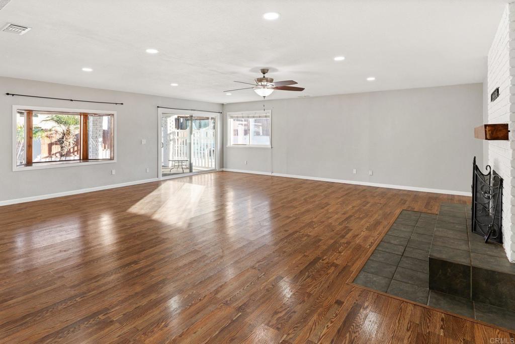 13131 Chrissy Way Lakeside, CA 92040 - Photo 7 of 30 an empty room with windows and fireplace