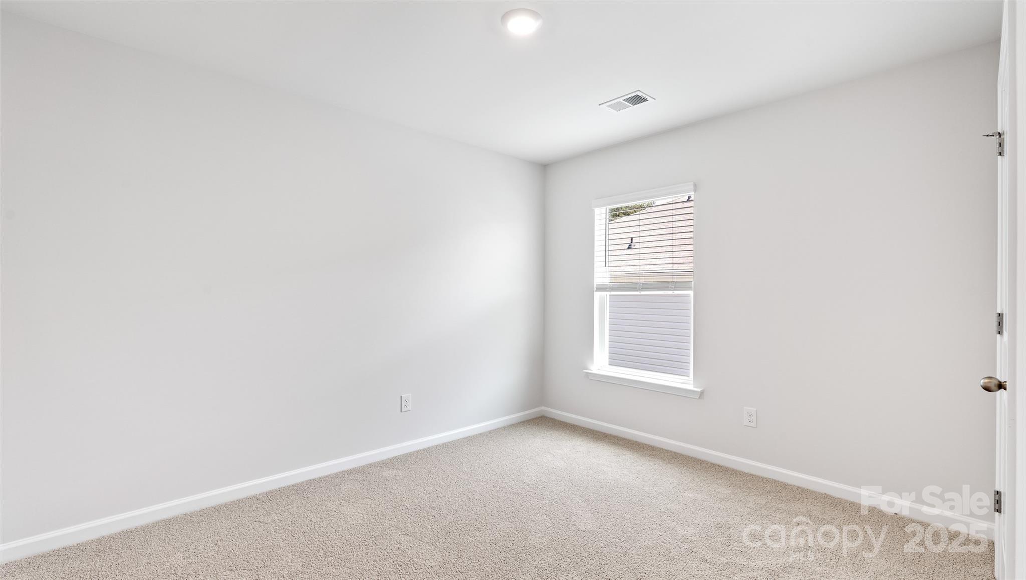 131 Bovine Br Road Fletcher, NC 28732 - Photo 14 of 31 a view of an empty room with a window