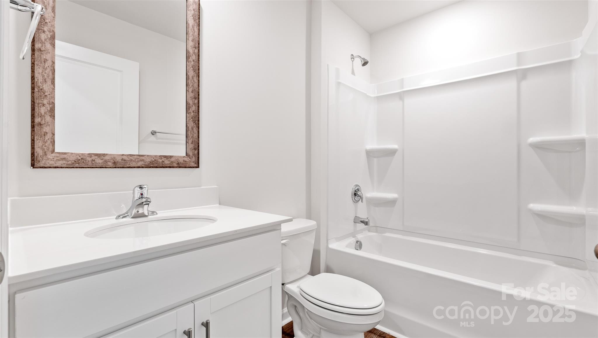 131 Bovine Br Road Fletcher, NC 28732 - Photo 16 of 31 a bathroom with a sink a toilet and shower