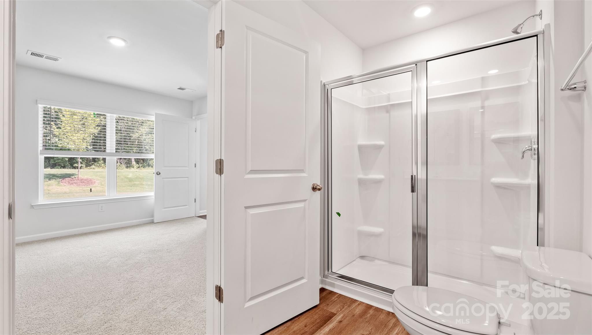 131 Bovine Br Road Fletcher, NC 28732 - Photo 20 of 31 a spacious bathroom with a glass shower door and a window