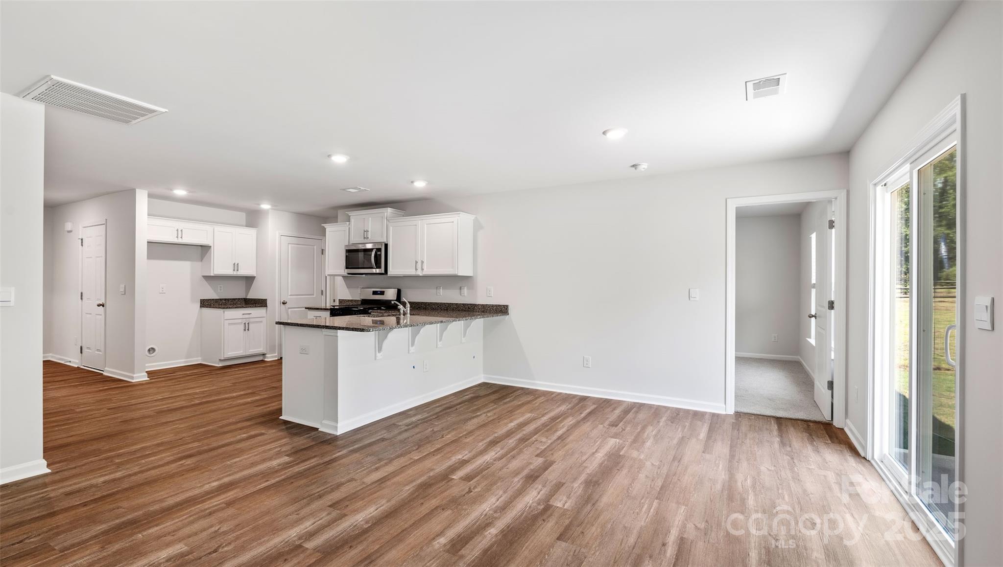 131 Bovine Br Road Fletcher, NC 28732 - Photo 8 of 31 a view of kitchen with wooden floor