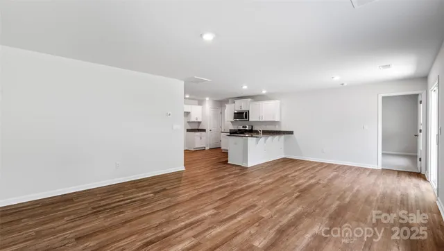 a view of kitchen with wooden floor