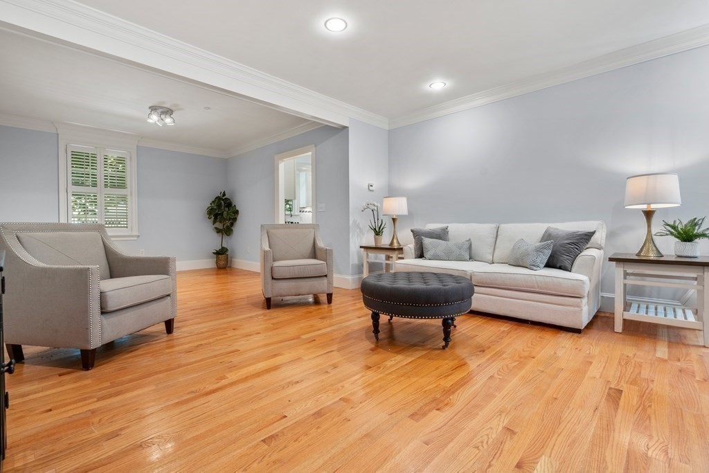 96 Crescent Street, Unit 96 Newton, MA 02466 - Photo 14 of 36 a living room with furniture and a wooden floor