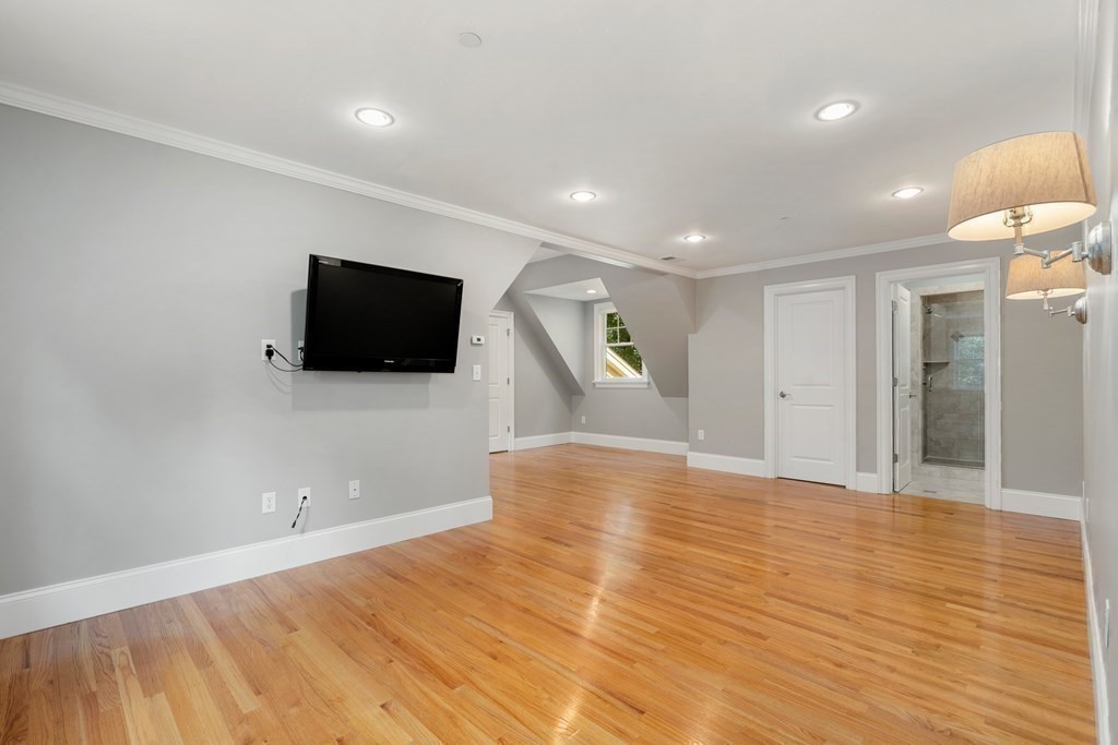 96 Crescent Street, Unit 96 Newton, MA 02466 - Photo 16 of 36 a view of a livingroom with a flat screen tv
