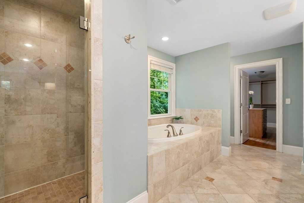 96 Crescent Street, Unit 96 Newton, MA 02466 - Photo 18 of 36 a spacious bathroom with a bathtub sink and mirror