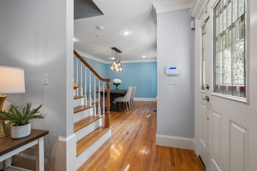 96 Crescent Street, Unit 96 Newton, MA 02466 - Photo 2 of 36 a view of entryway and hall with wooden floor