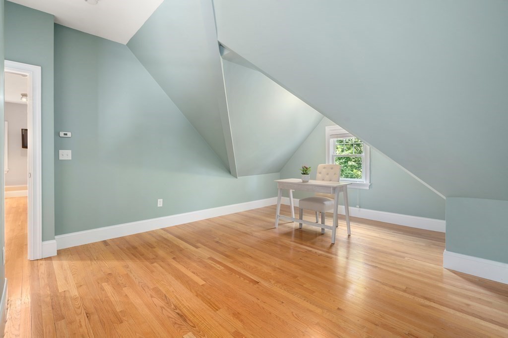 96 Crescent Street, Unit 96 Newton, MA 02466 - Photo 23 of 36 a view of an empty room with wooden floor