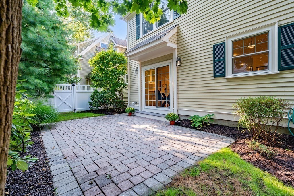 96 Crescent Street, Unit 96 Newton, MA 02466 - Photo 30 of 36 a front view of a house with garden