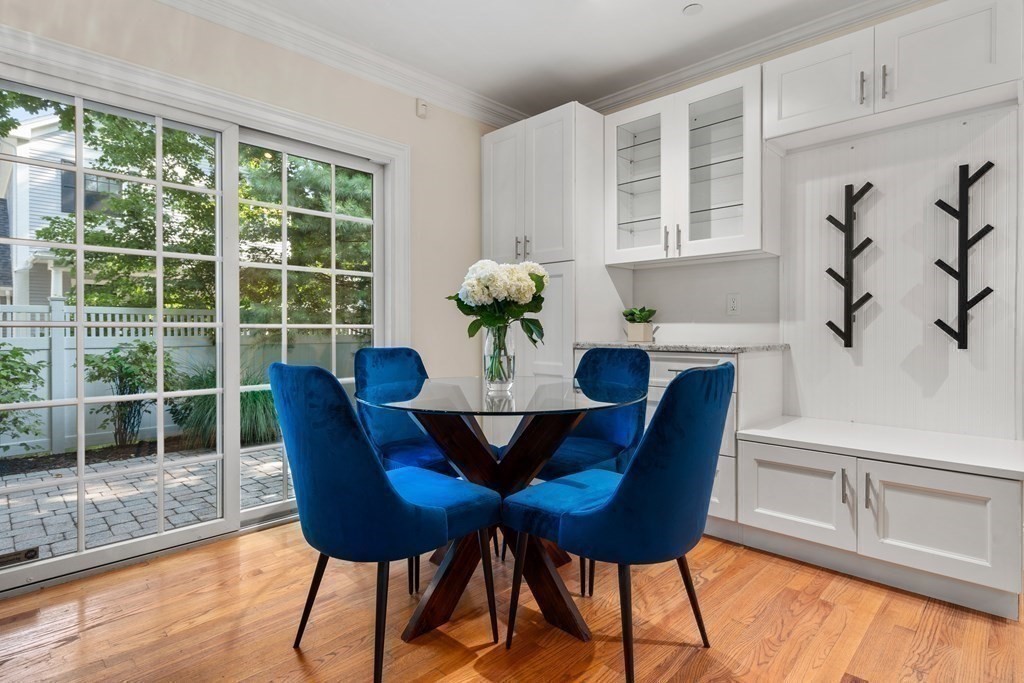 96 Crescent Street, Unit 96 Newton, MA 02466 - Photo 8 of 36 a view of a dining room with furniture window and wooden floor