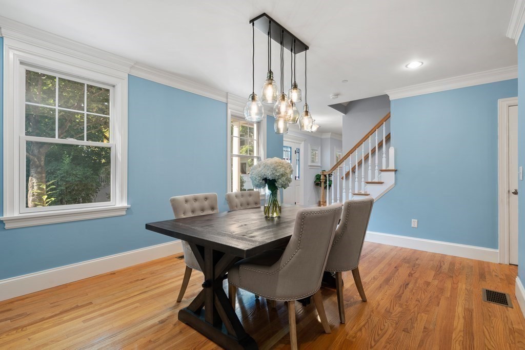 96 Crescent Street, Unit 96 Newton, MA 02466 - Photo 10 of 36 a view of a dining room with furniture window and wooden floor