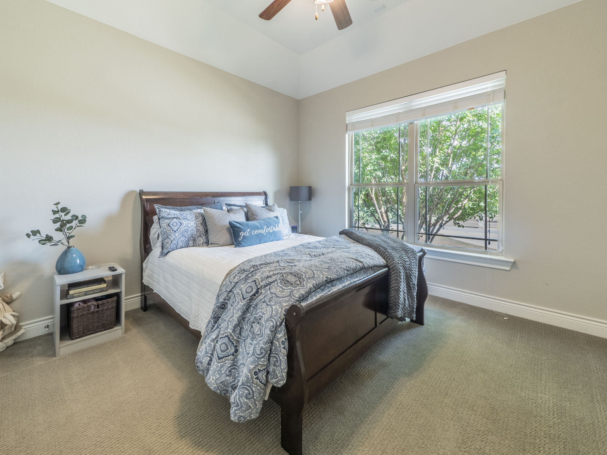 205 Standing Oak Drive Georgetown, TX 78633 - Photo 13 of 31 a bed sitting in a bedroom next to a window