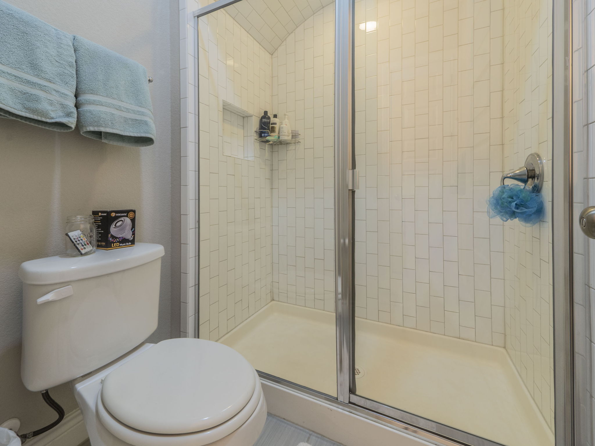205 Standing Oak Drive Georgetown, TX 78633 - Photo 20 of 31 a white toilet next to a bathroom sink