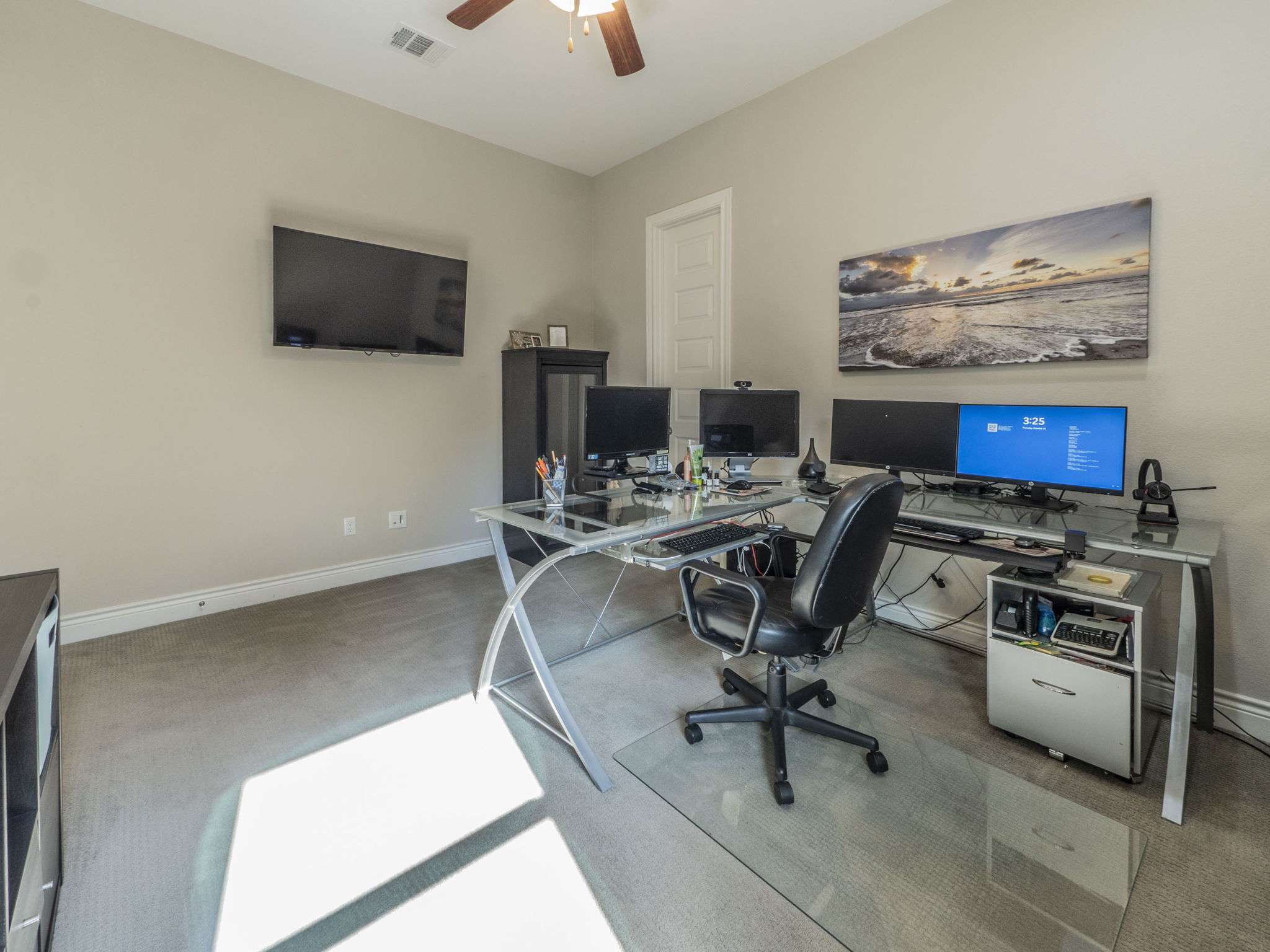 205 Standing Oak Drive Georgetown, TX 78633 - Photo 21 of 31 a view of a workspace with furniture and a flat screen tv