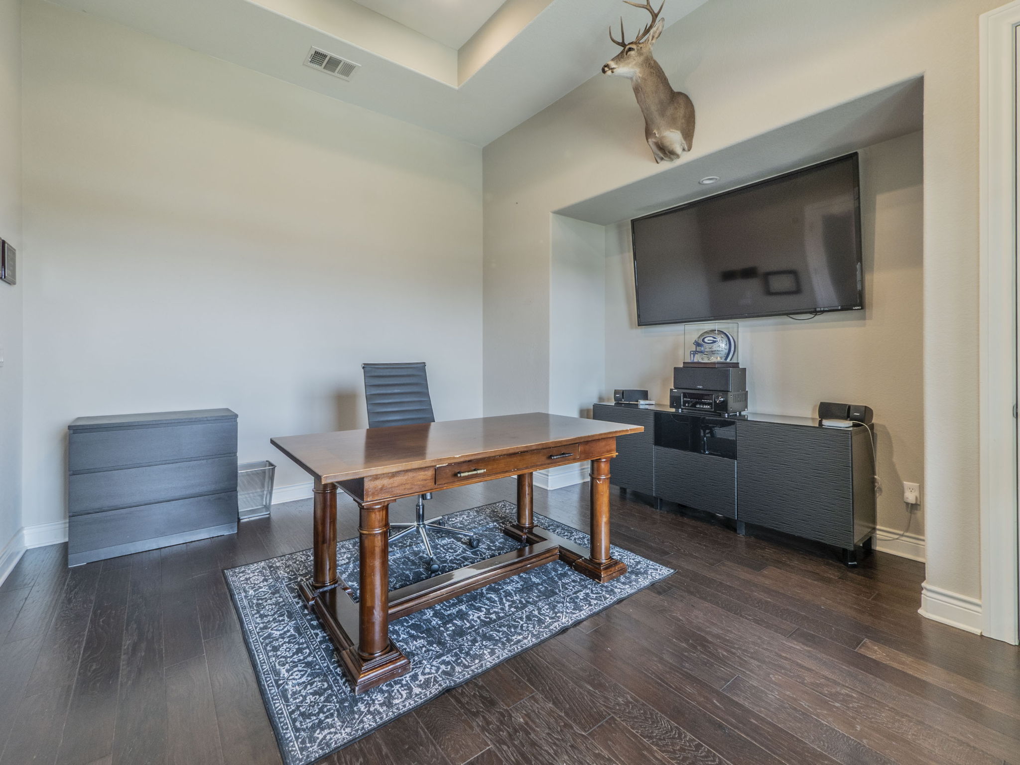 205 Standing Oak Drive Georgetown, TX 78633 - Photo 23 of 31 a living room with furniture and a flat screen tv
