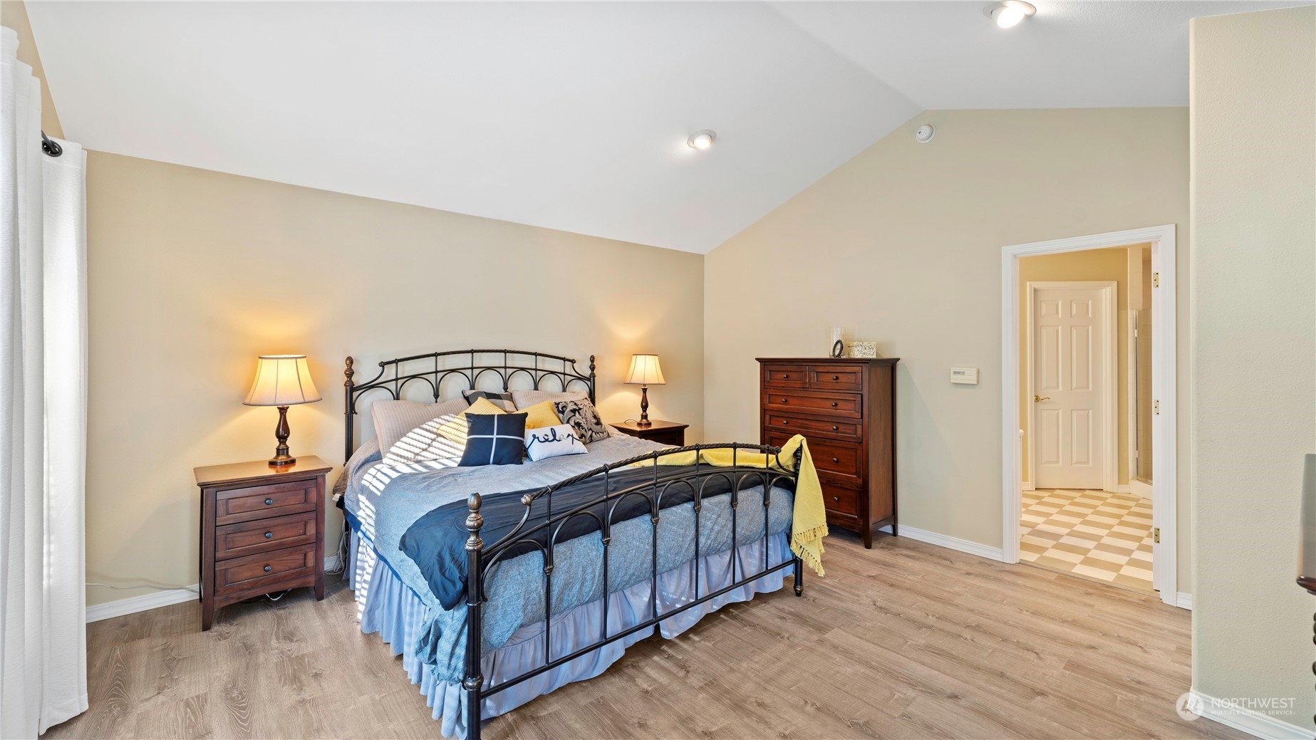 14293 Rosario Road Anacortes, WA 98221 - Photo 14 of 40 a bedroom with a bed next to a window with closet