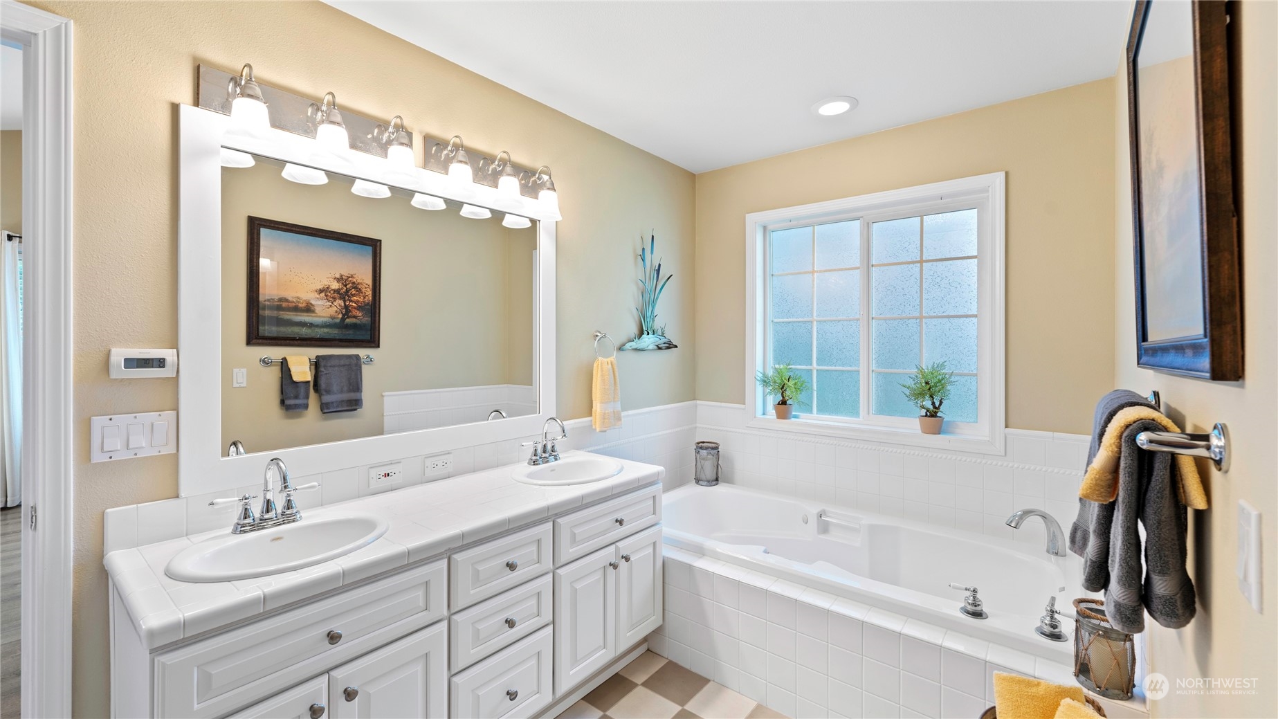14293 Rosario Road Anacortes, WA 98221 - Photo 16 of 40 a bathroom with a tub a sink and mirror