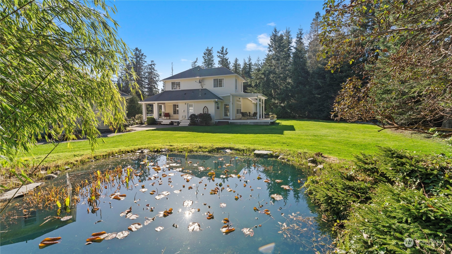 14293 Rosario Road Anacortes, WA 98221 - Photo 2 of 40 a view of a house with a big yard