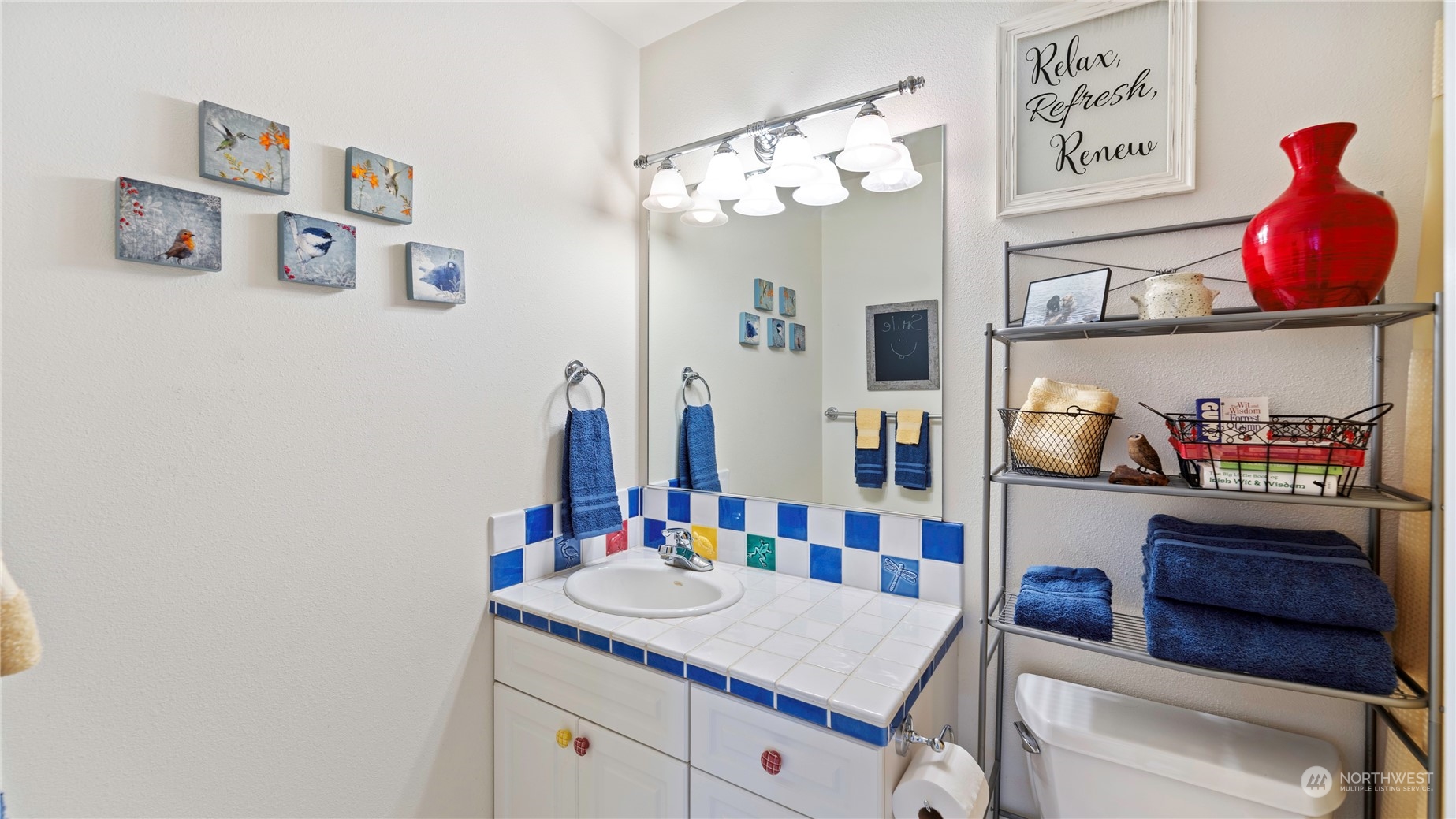 14293 Rosario Road Anacortes, WA 98221 - Photo 22 of 40 a bathroom with a sink vanity and a mirror