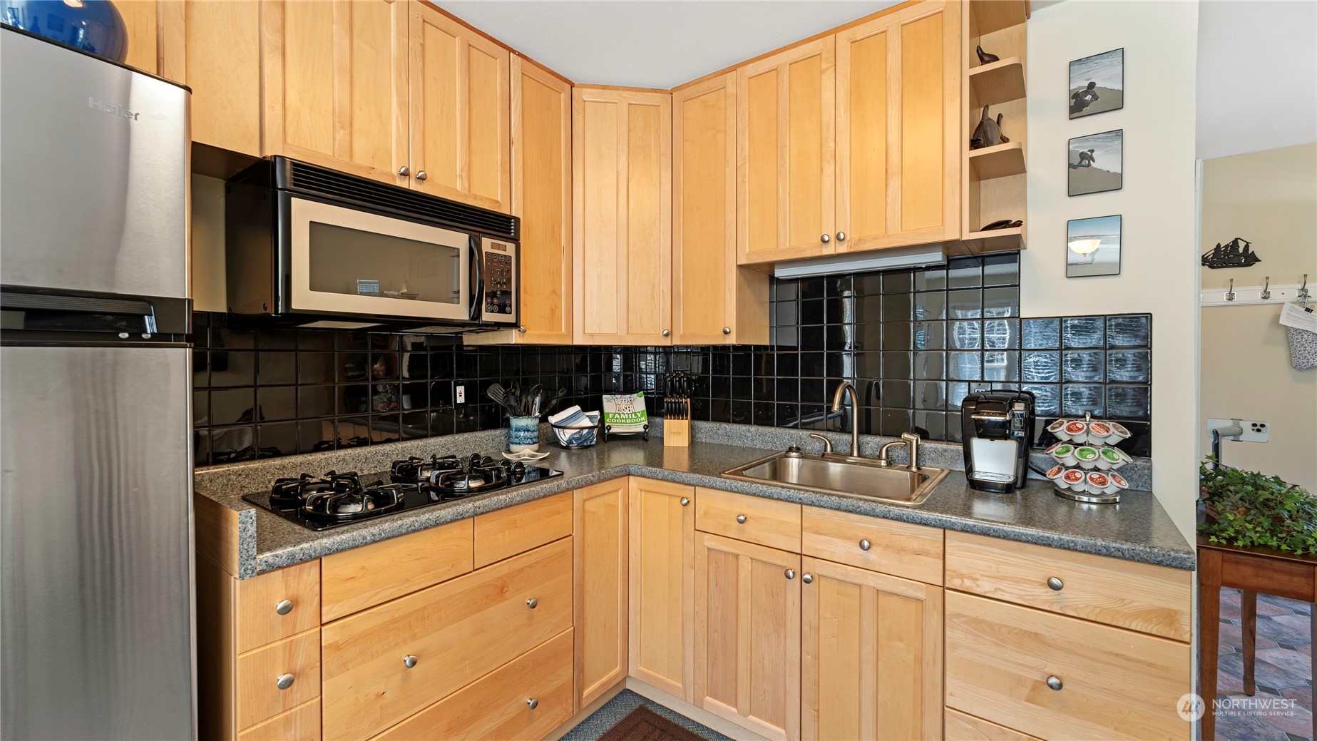 14293 Rosario Road Anacortes, WA 98221 - Photo 26 of 40 a kitchen with stainless steel appliances a stove a sink and a microwave