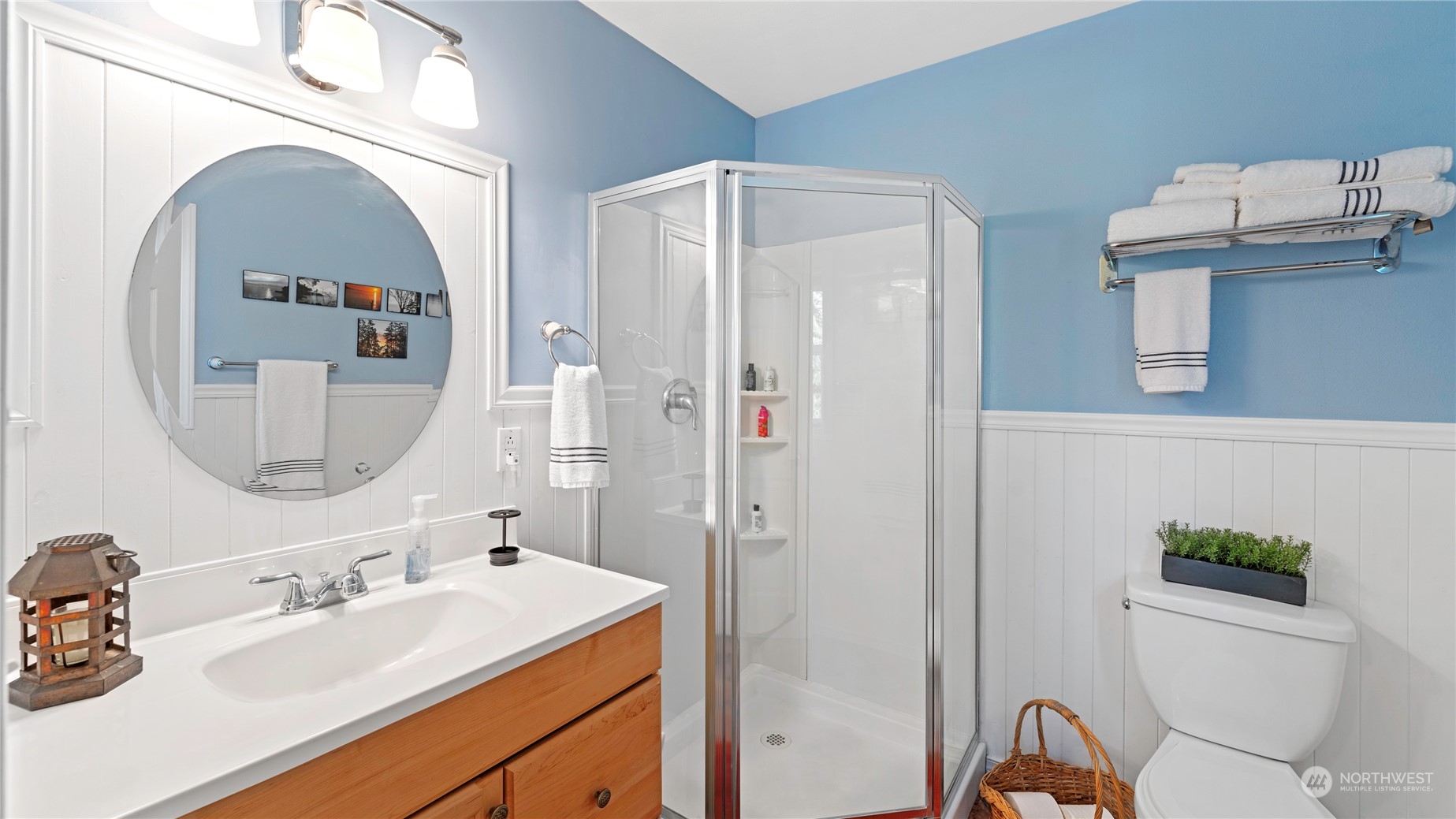 14293 Rosario Road Anacortes, WA 98221 - Photo 27 of 40 a bathroom with a sink a toilet and a mirror