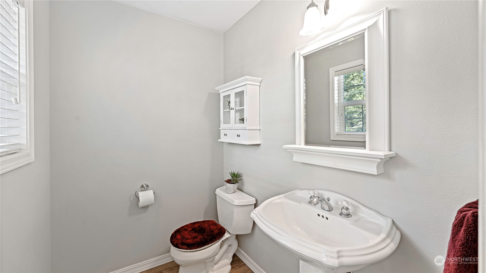 14293 Rosario Road Anacortes, WA 98221 - Photo 30 of 40 a white toilet sitting next to a bathroom sink
