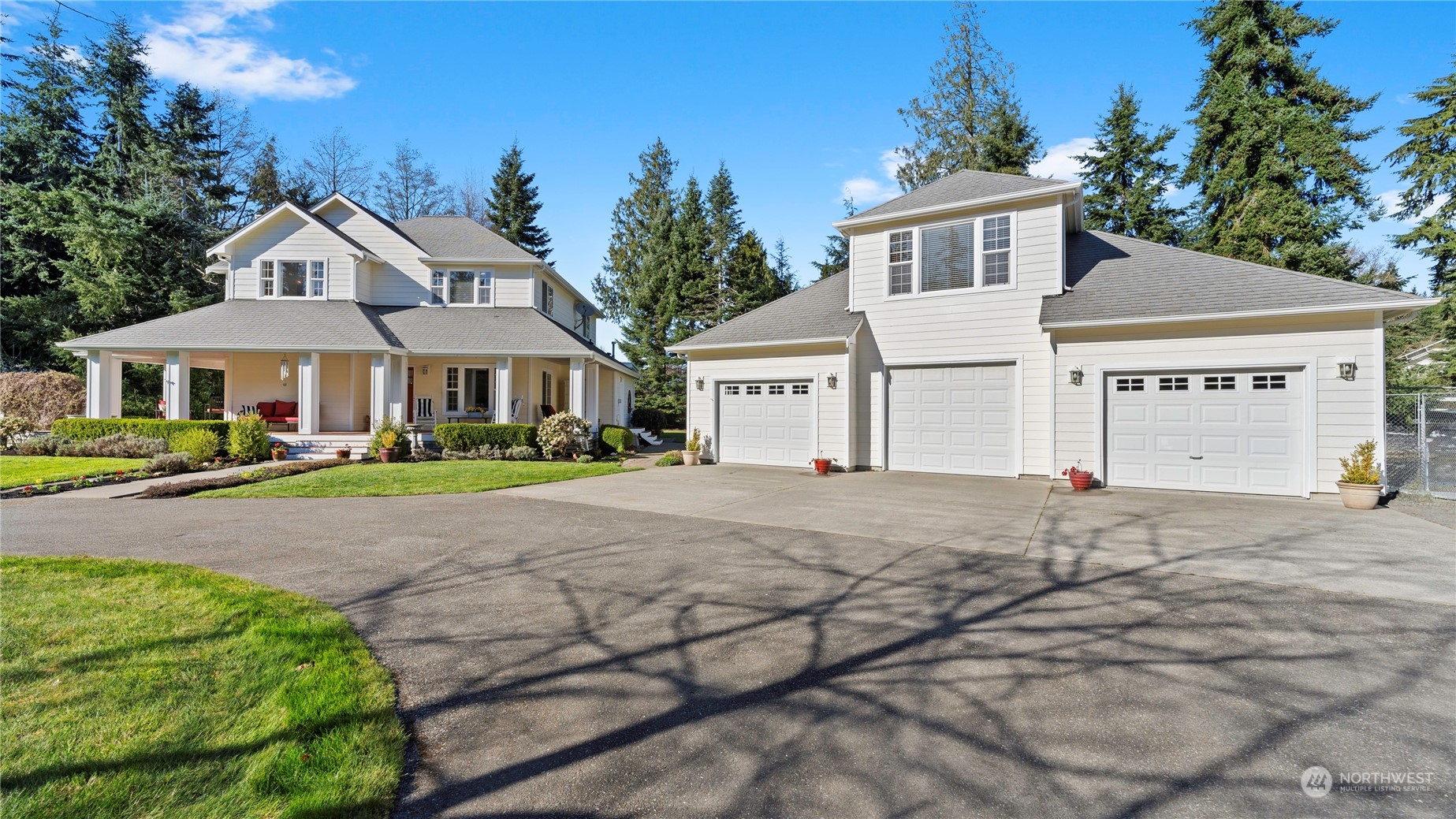 14293 Rosario Road Anacortes, WA 98221 - Photo 33 of 40 a front view of a house with a yard and trees