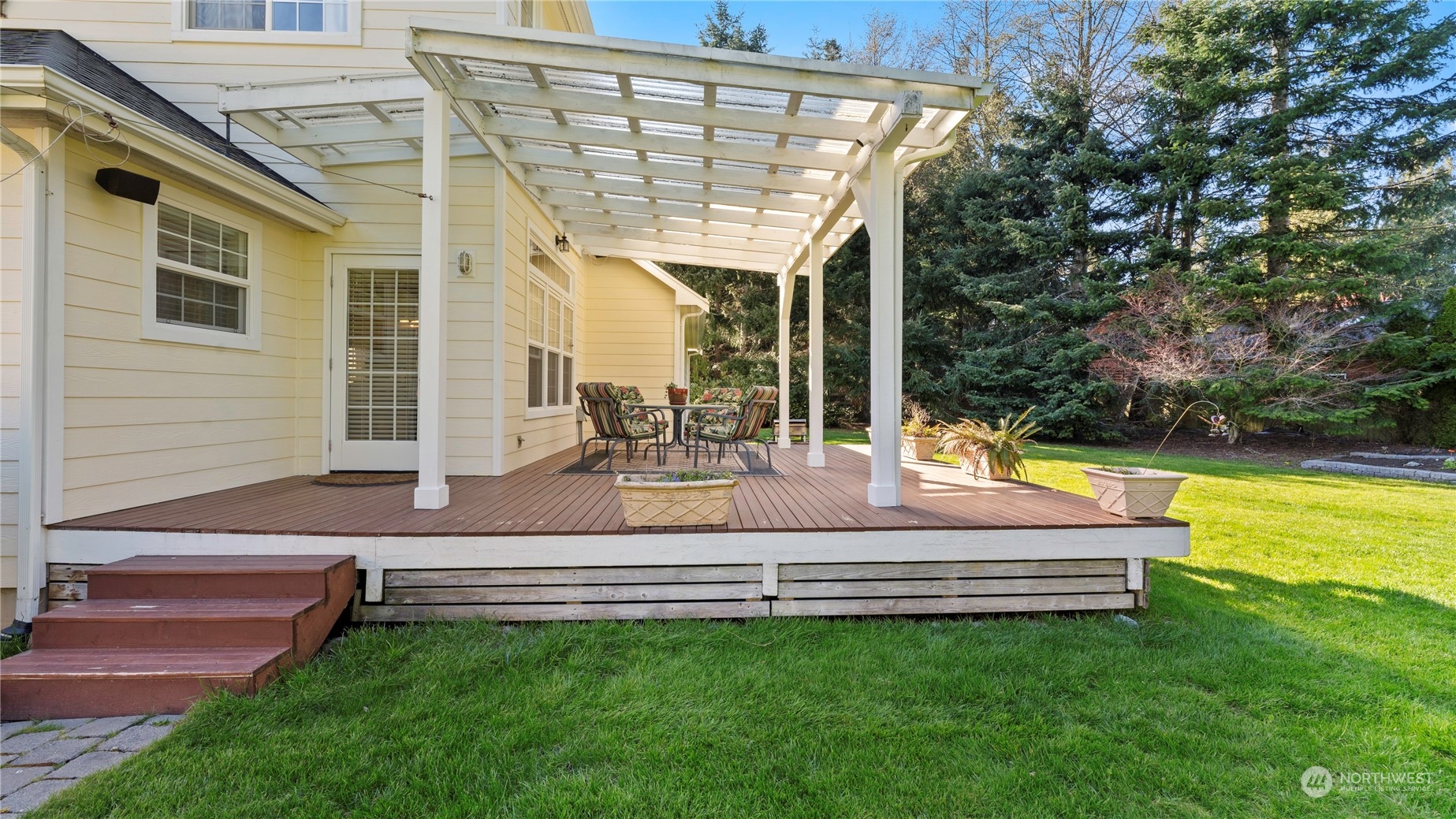 14293 Rosario Road Anacortes, WA 98221 - Photo 35 of 40 a view of a house with a backyard