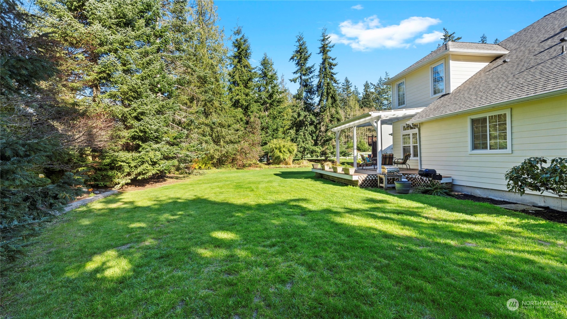 14293 Rosario Road Anacortes, WA 98221 - Photo 37 of 40 a view of backyard of house with green space