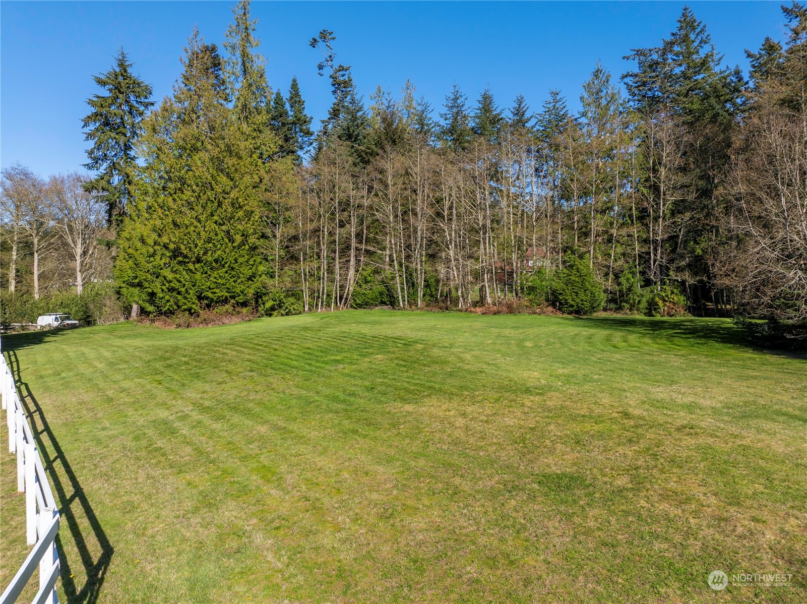 14293 Rosario Road Anacortes, WA 98221 - Photo 39 of 40 a view of a field with trees in the background
