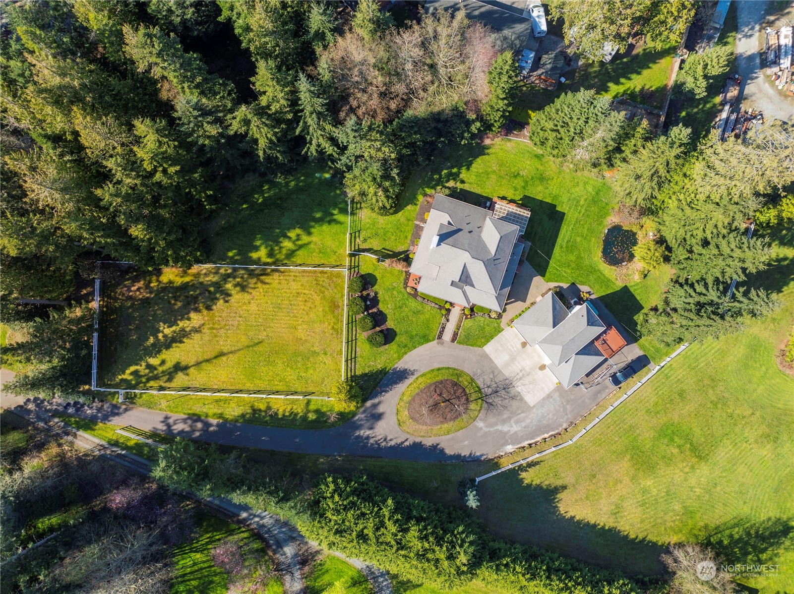 14293 Rosario Road Anacortes, WA 98221 - Photo 40 of 40 an aerial view of a house with a yard and garden